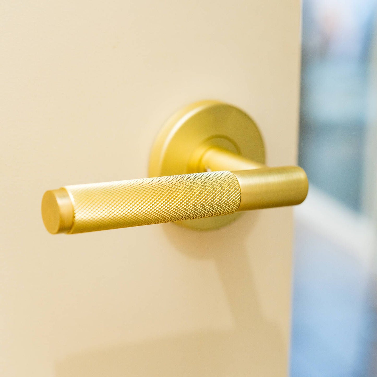 Ikonic Brushed Brass Knurled Passage Lever Set